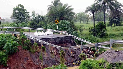 &nbsp;A washed-away portion of a road is seen washed on Ranchi-Daltonganj route amid rainfall, in Ranchi (PTI)