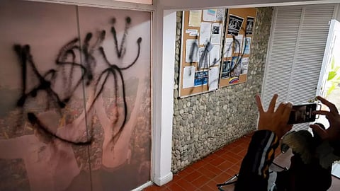 Graffiti covers the wall inside the election campaign headquarters of opposition leader Maria Corina Machado and presidential candidate Edmundo Gonzalez. (Photo: AP)