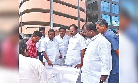 Ministers KN Nehru and Thangam Thennarasu taking stock of the ongoing works at Palayamkottai new bus stand in Tirunelveli on Sunday