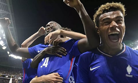 France's Jean-Philippe Mateta(14), left, celebrates with teammates (AP)&nbsp;
