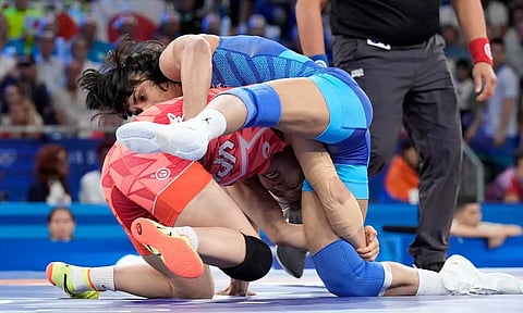 Vinesh Phogat (In Blue) during her bout against Yui Susaki