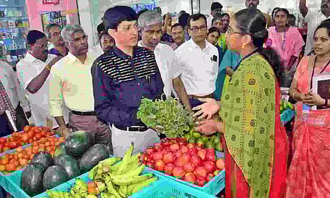PHOTO: J Radhakrishnan, Additional Chief Secretary of Cooperation and Consumer Protection Department, inspects a Chinthamani Cooperative Society shop in Coimbatore on Thursday.