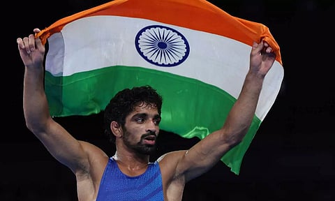 Aman Aman of India celebrates defeating Darian Toi Cruz of Puerto Rico (PTI)