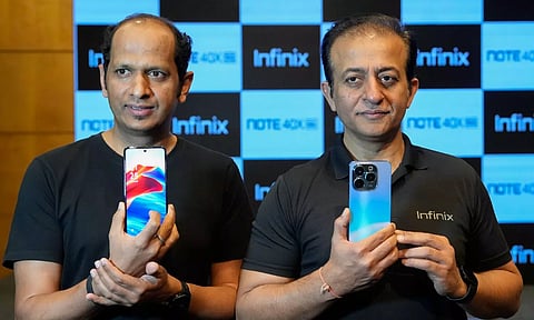: Infinix CEO Anish Kappor (R) and Product Head Kamal Pandey launch their new Infinix Note 40X mobile phone