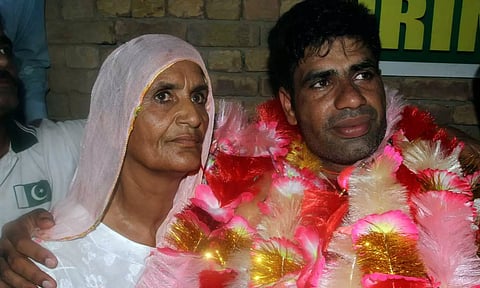 Men's javelin gold medalist, Arshad Nadeem, of Pakistan Arshad Nadeem poses for a photograph with his mother