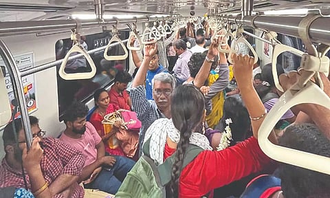 A crowded general coach on a Metro train