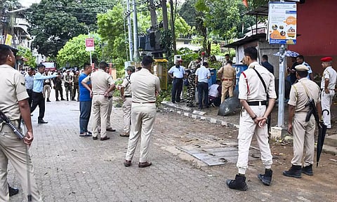 Security personnel at the spot after a suspected Improvised Explosive Device (IED) was recovered on a road to Gandhi Mandap, in Guwahati (PTI)