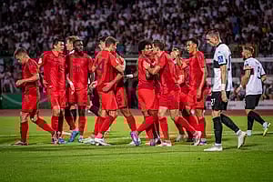 Players celebrating after victory
