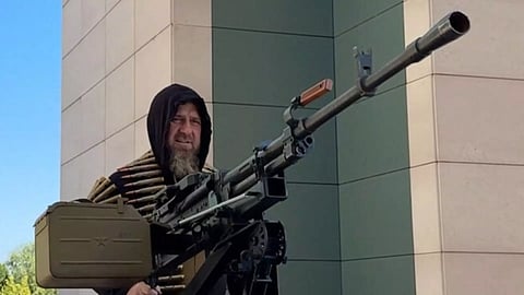 Kadyrov in the Tesla Cybertruck with a machine gun&nbsp; (AP)