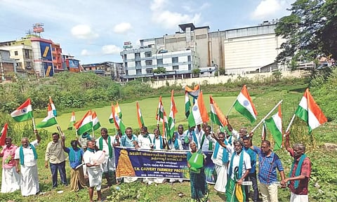 Farmers protest in front of an irrigation tank at Kumbakonam on Monday