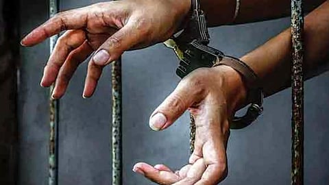 Person behind the bars&nbsp;