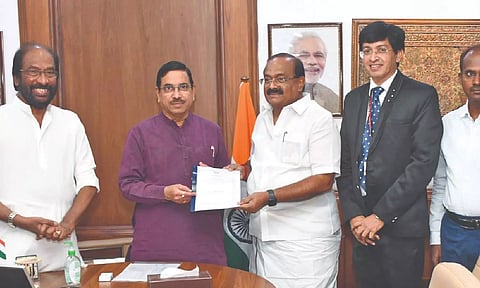 Minister R Sakkarapani submitting a memorandum to Union Minister Prahlad Joshi in New Delhi on Wednesday