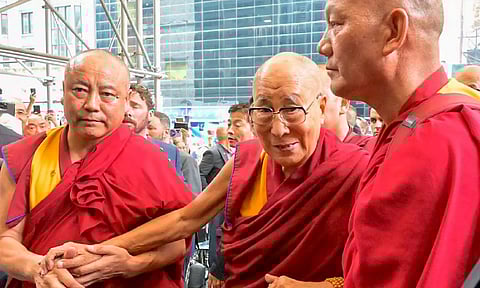 Tibetan spiritual leader Dalai Lama being welcomed by members of the Tibetan community upon his arrival in New York (PTI)