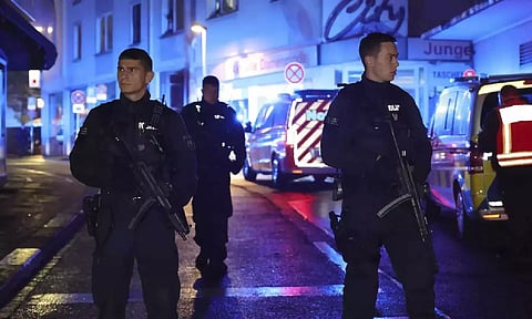 Police and ambulances near the scene where people were attacked at a festival in Solingen, western Germany (AP)