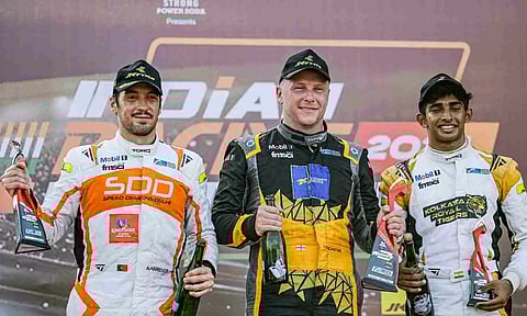 Photo Caption: (L-R) Alvaro Parente, Jon Lancaster, Ruhaan Alva celebrate on the podium
