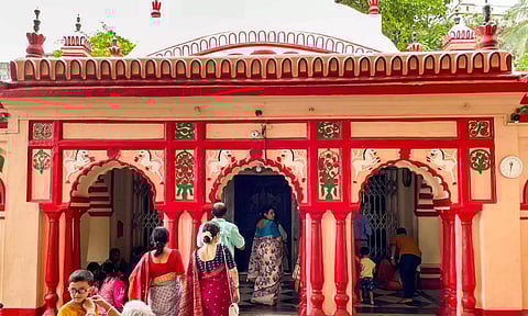 Visitors at the Dhakeshwari National Temple enter a gateway on the premises of the shrine at Old Dhaka area, in Dhaka (PTI)