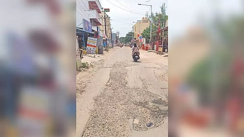 Pothole-riddled Kadappa Road, Kolathur, poses a danger to commuters