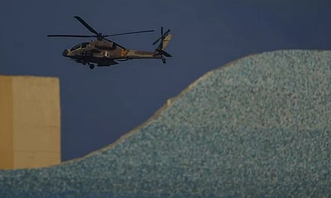An Israeli Apache helicopter flies over Israel (AP)