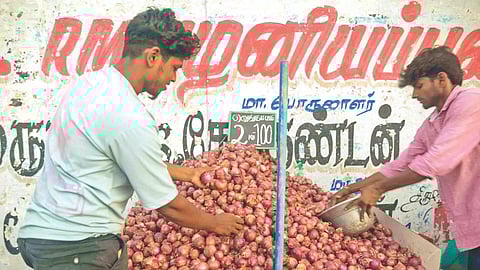 Roadside vendors selling 2 kg onions for Rs 200