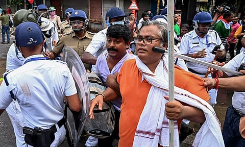 Police personnel lathi-charge agitators during a protest march of students towards West Bengal Secretariat (PTI)