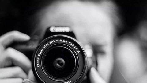 A women holding a camera