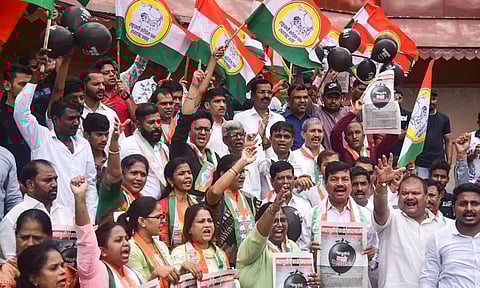 NCP (Sharad Pawar camp) leader Jitendra Awhad washes the statue of Chhatrapati Shivaji Maharaj in protest against the collapse of Malvan's Shivaji Maharaj statue, in Thane (PTI)