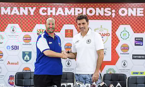 Rival coaches Juan Pedro Benali and Jose Molina at a press conference