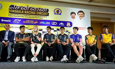 Participating race car drivers Nikhil Bohra (C), Gabriela Jilkova (3L) and others during a press conference