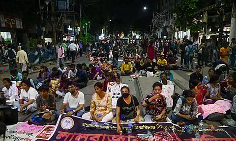 Junior doctors stage a protest on a road leading to Lalbazar police headquarters demanding the resignation of Police Commissioner Vineet Goyal over the case of alleged sexual assault and murder of a trainee doctor