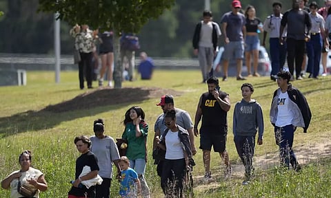 Students and parents walk off campus at Apalachee High School (AP)&nbsp;