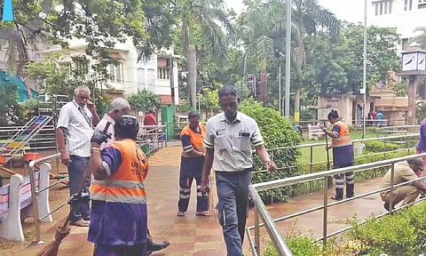 GCC workers clean a park on East Circular Road, RA Puram, on Friday