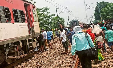 People gather after the Magadh Express train splited into two parts after an accident near Tudiganj station, in Buxar (PTI)
