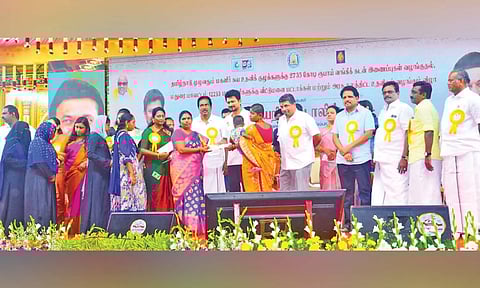 Youth Welfare and Sports Minister Udhayanidhi Stalin handing over patta to beneficiaries in Madurai