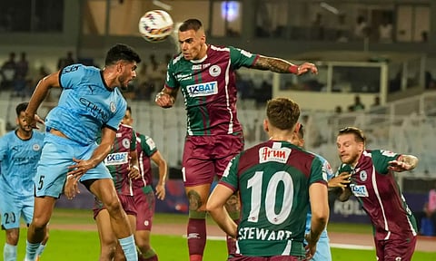 Mohun Bagan Super Giants and Mumbai City FC players vie for the ball during an ISL match (PTI)