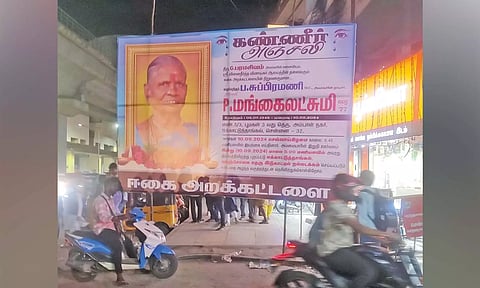 Private hoarding on footpath in Ekkatuthangal