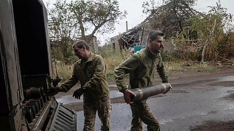 Ukrainian soldiers unloading artillery shells&nbsp;