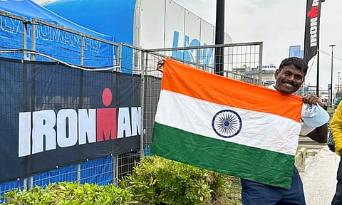 Vishwas Mote poses with the national flag after he completed 'Ironman Italy Emilia Romagna' Triathlon in Italy recently (PTI)