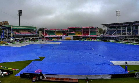 Covers placed on the ground following rains, during the second day of the 2nd Test cricket match between India and Bangladesh, at the Green Park Stadium, Kanpur (PTI)