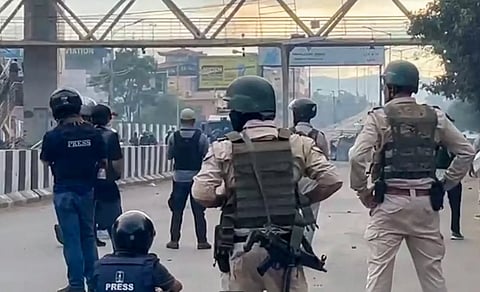 Security personnel in a clash with students who were protesting over recent violence, in Imphal (PTI)