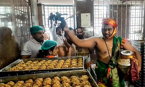 A priest performs the purification ritual 'Shanti Homam Panchagavya Prokshana' to undo the alleged desecrations that occurred at Sri Venkateswara Swamy Temple at Tirumala in Tirupati district, AP (PTI)