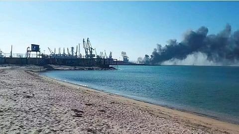 Smoke rises after shelling near a seaport in Berdyansk, Ukraine, after the reported sinking of a Russian navy ship. (AP)