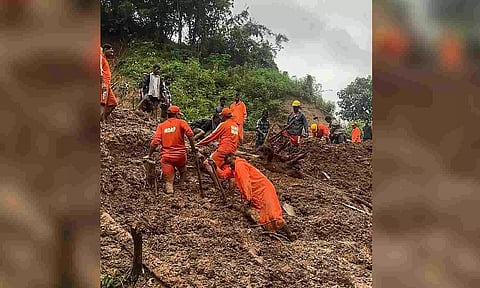 earch operation underway to retrieve the bodies of members of a family who got buried in a landslide (PTI)