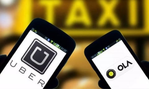 Logos of Ola and Uber (IANS)