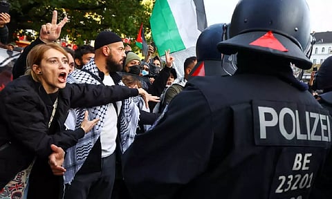Police officers confront demonstrators as protesters rally in support of Palestinians, on the
one-year anniversary of Hamas' October 7 attack, amid the ongoing Israel-Hamas conflict, Berlin,
Germany