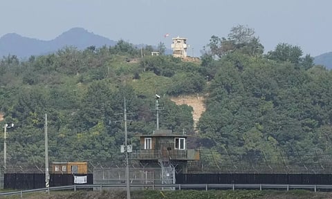 A North Korean military guard post, top, and a South Korean post, bottom, are seen from Paju, South Korea, near the border with North Korea (AP)
