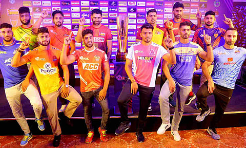 Club captains pose with the PKL trophy during the launch event