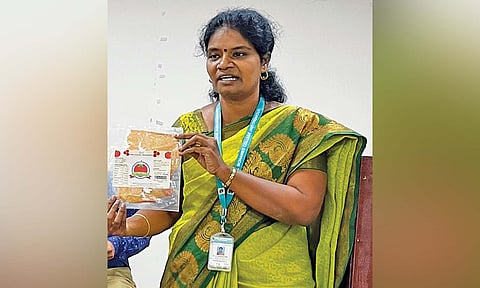 Professor Sangeetha with the tomato sheet