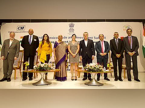 Finance Minister Nirmala Sitharaman with other attendees (Photo/X@FinMinIndia)
