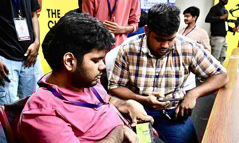 Thirumurugan Velu playing the 'Real Cricket' game at CM Trophy (Rakesh Geloth)