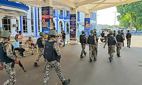 Security personnel keep a vigil after a flight made an emergency landing at the airport following an alleged bomb threat, in Jodhpur (PTI)